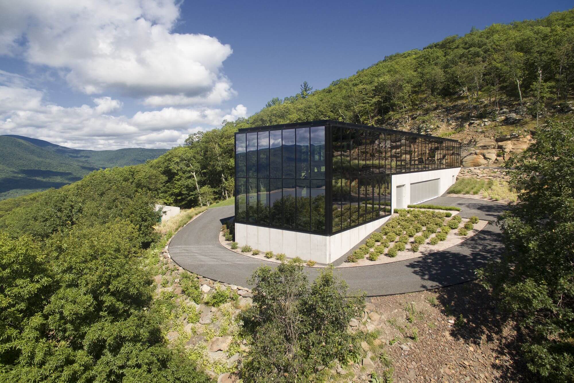 exterior of glass box house side view