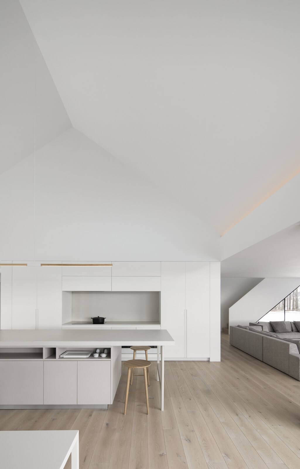 Knowlton Residence kitchen with white walls and a wooden floor
