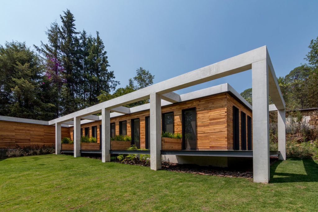 SP Residence with a covered patio and a pergolated lawn