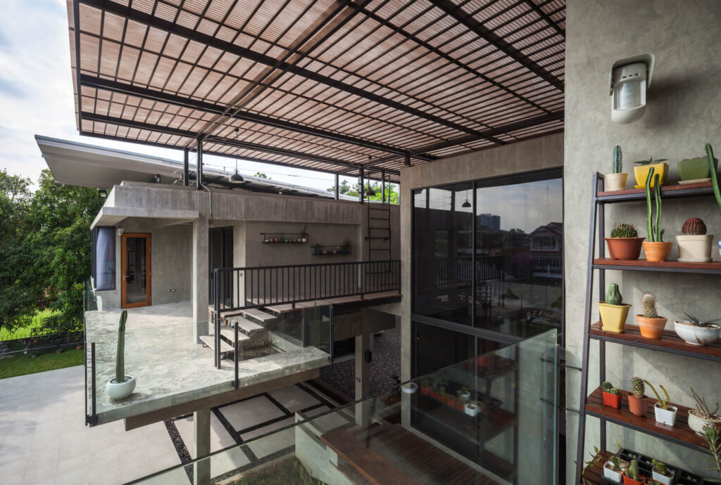 Sala Canal house with a glass balcony and a metal roof
