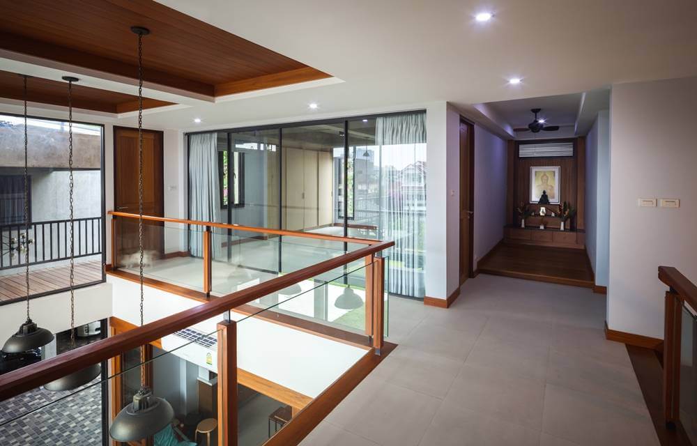 Sala Canal House  with a glass railing and wooden ceiling 