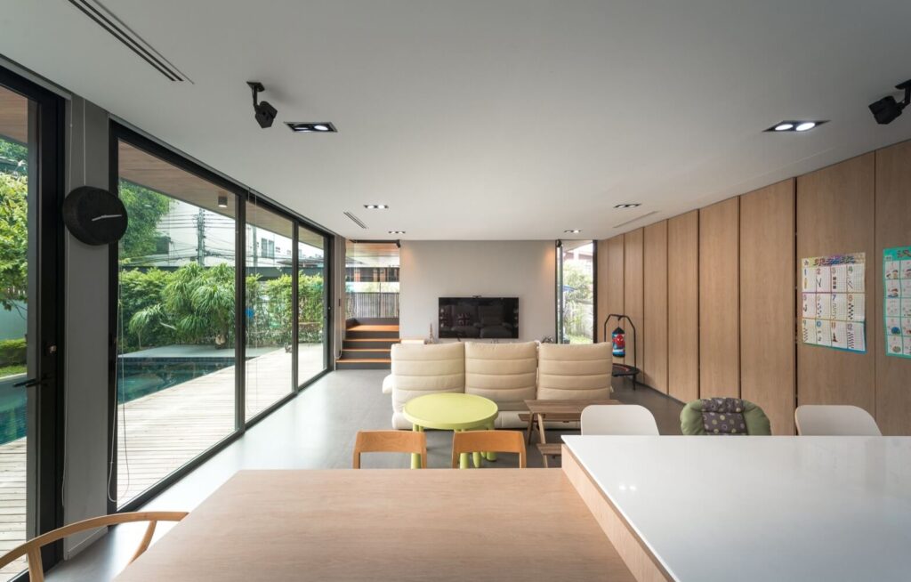 living room with furniture and lots of windows 