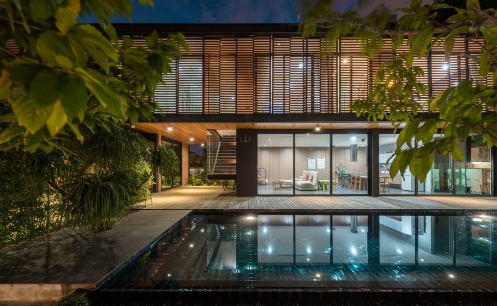 U38 House that has a pool in front of it 