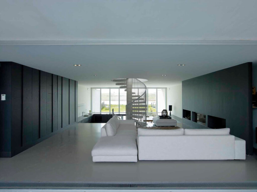 A modern living room with a spiral staircase  of W House