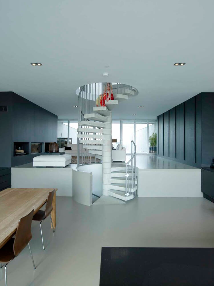 A spiral staircase in the middle of a room
