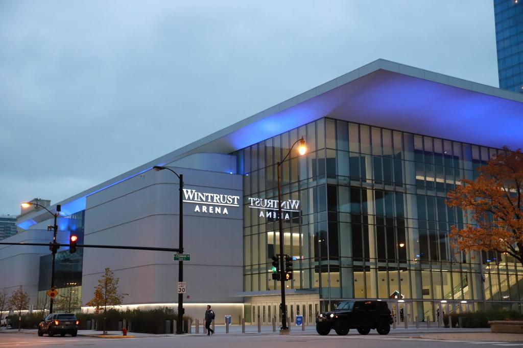 wintrust arena  with a blue light on the side of it 