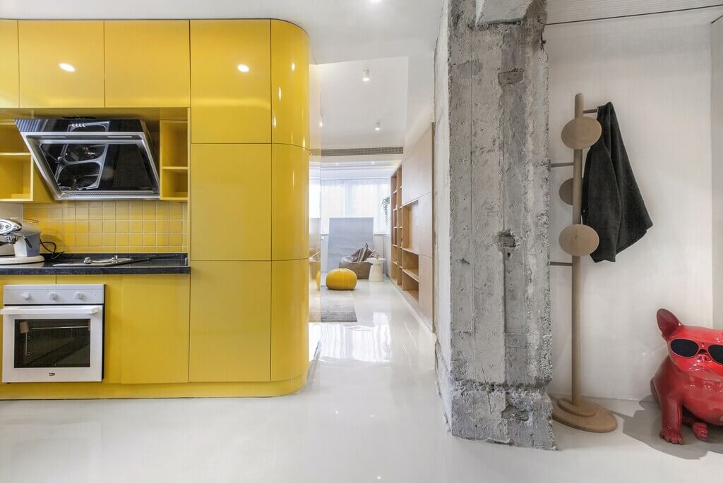 Kitchen area of Shanghai Apartment With Rotating Boxes by TOWOdesign
