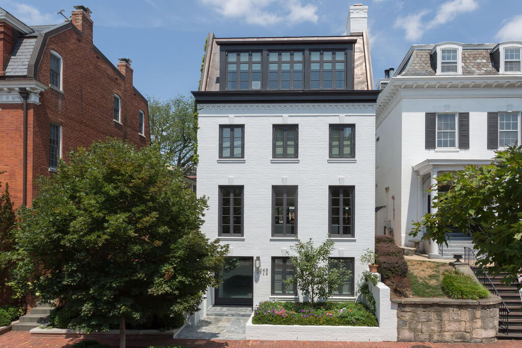 A white house with a lot of windows
