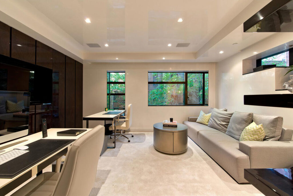 modern townhouse  living room with furniture and a flat screen tv
