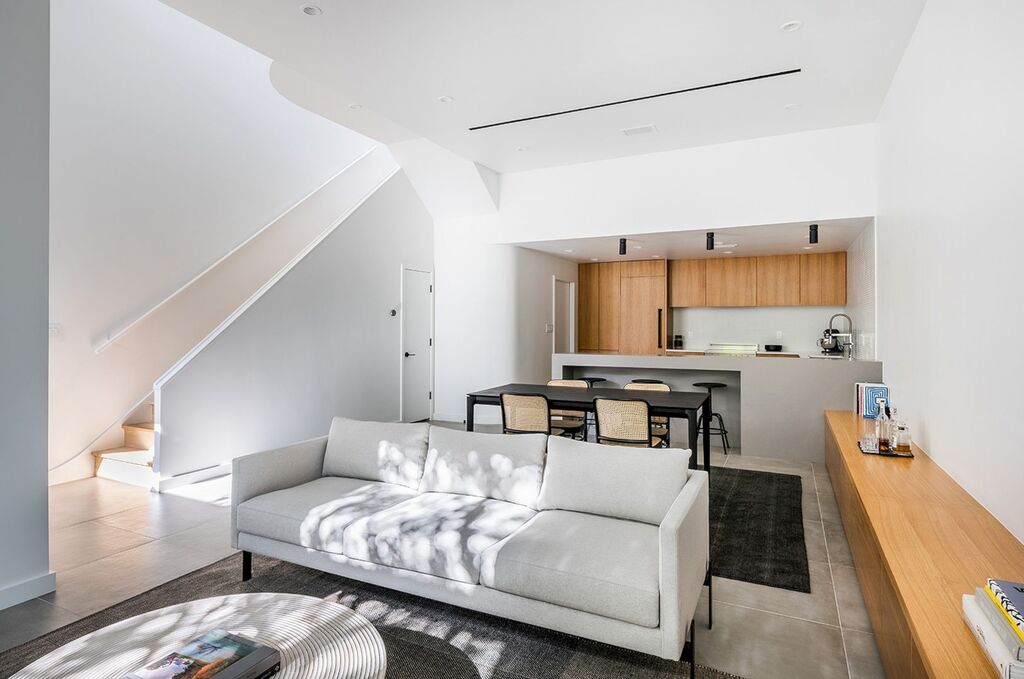 modern townhouse living room filled with furniture and a white couch