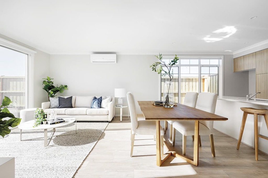 modern townhouse  living room with furniture and a wooden table
