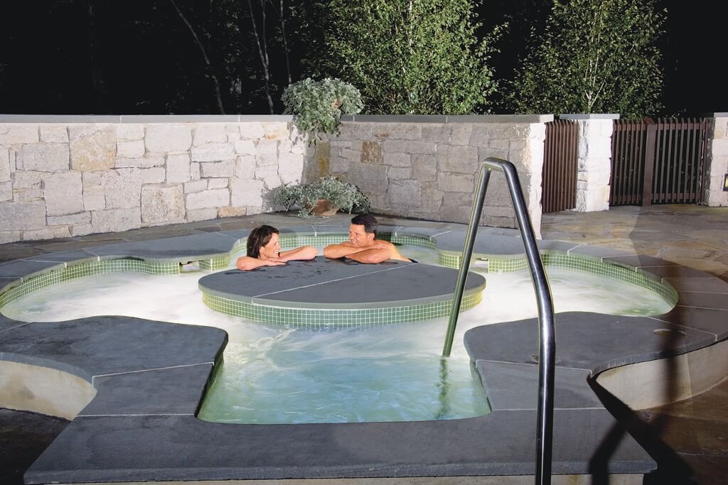 A couple that are in a hot tub
