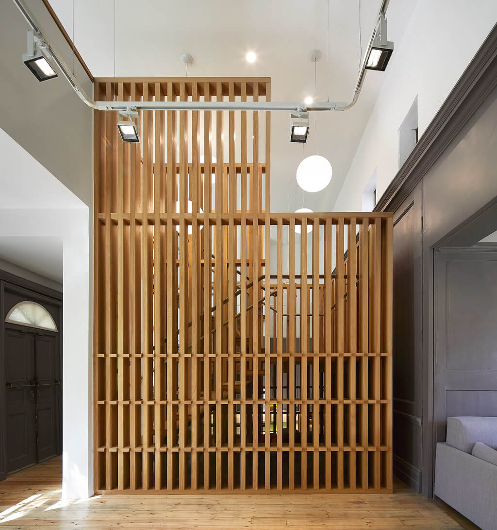 A room with a wooden divider in the middle of Museum of the Home