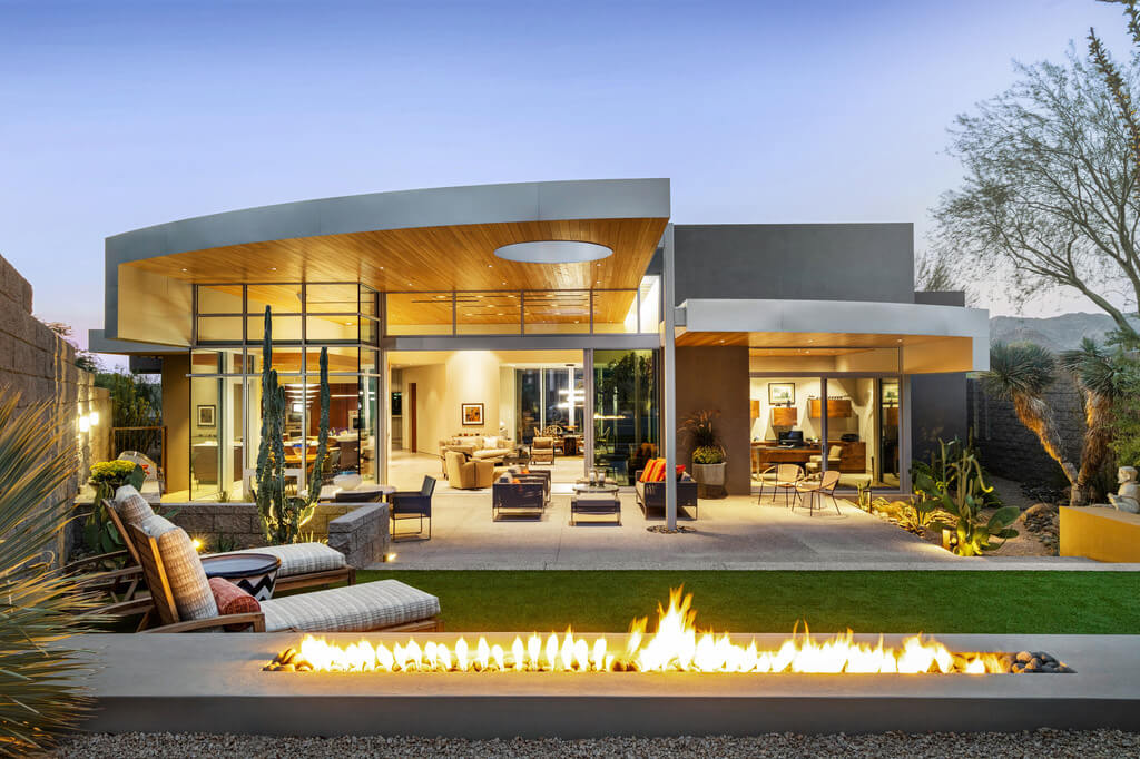 Echo Canyon Residence with a fire pit in front of it