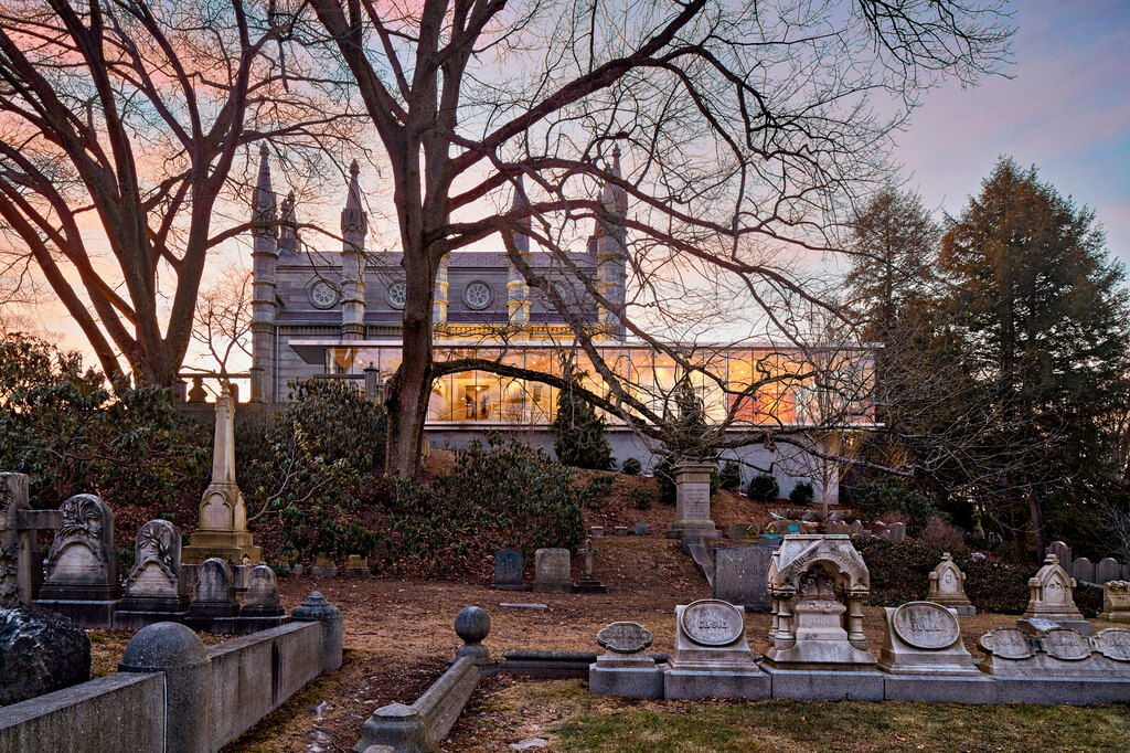 Mount Auburn Cemetery  with a building in the background
