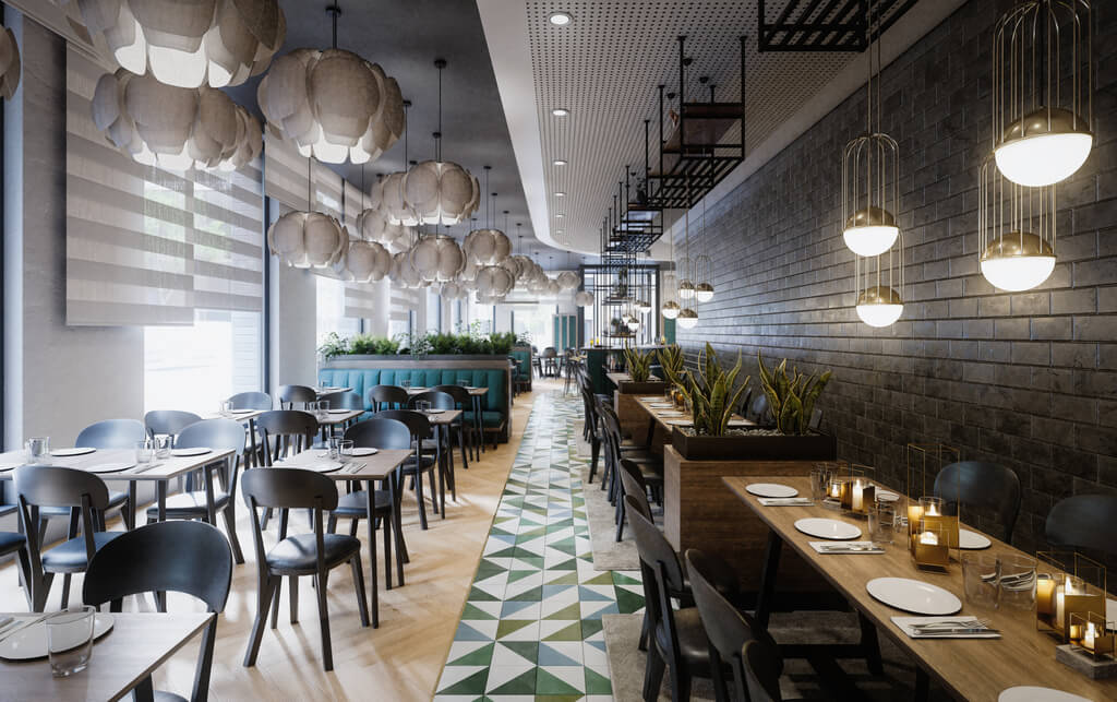 A restaurant with tables and chairs and hanging lights
