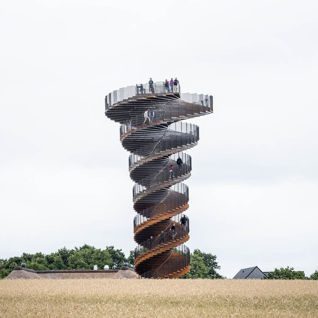 marsk tower with people standing on top of it 