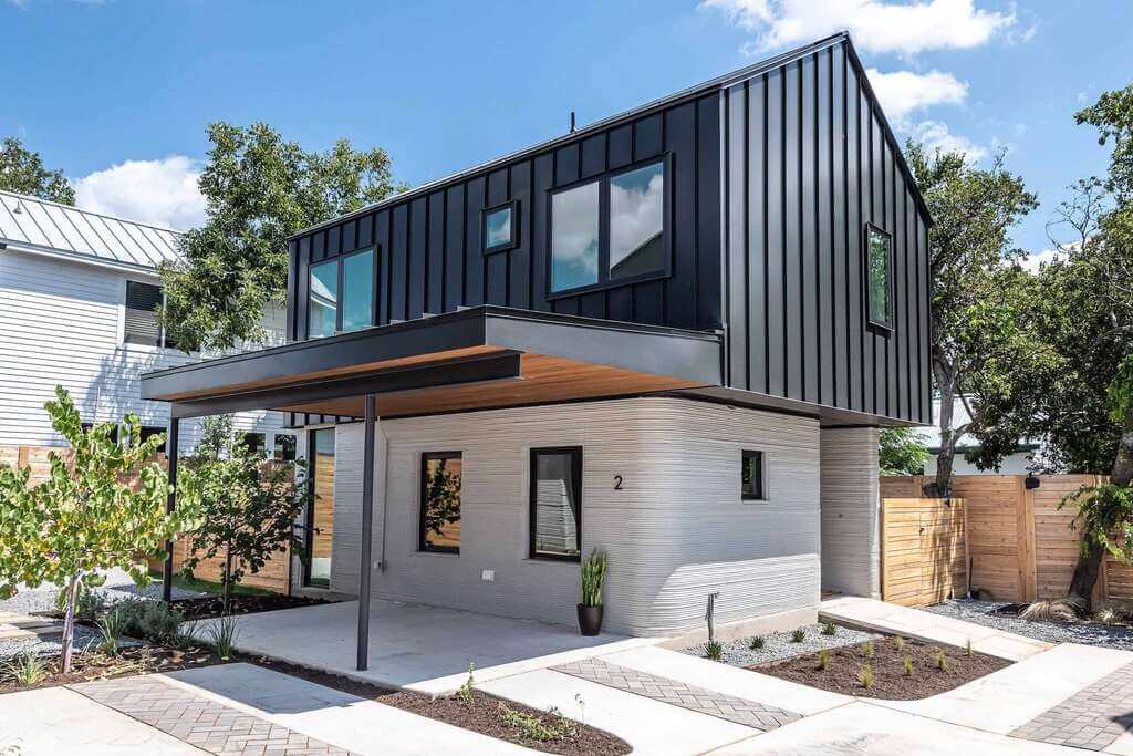A black and white 3D Printed Houses In Austin with a wooden roof
