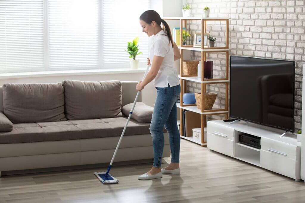 a women clean the house floor