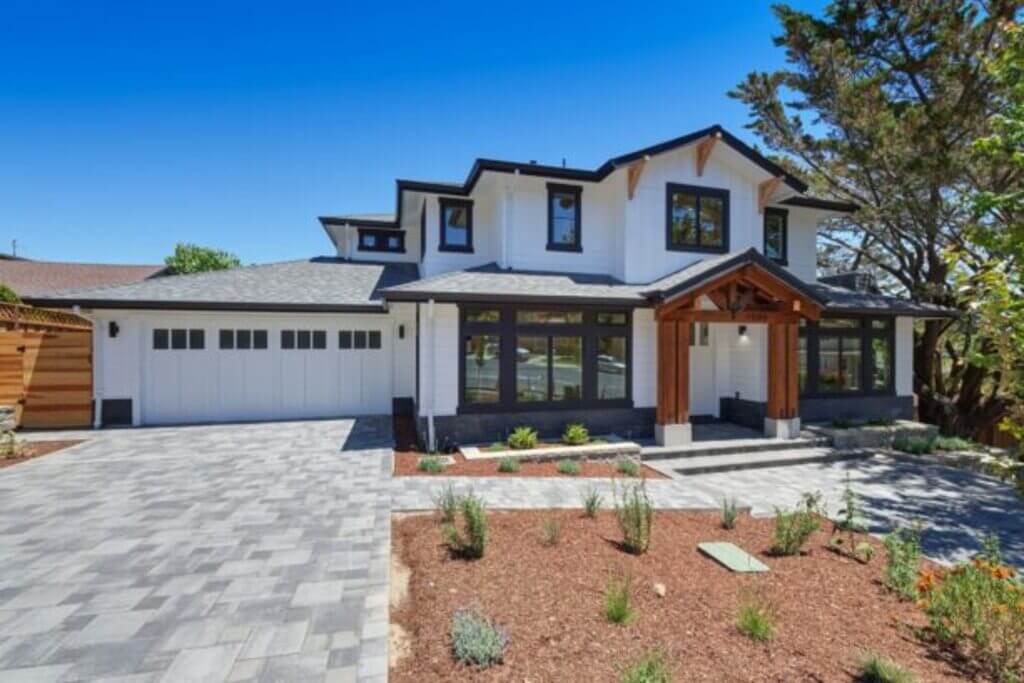 Wood Accent in a White Home Exterior with Black Trim