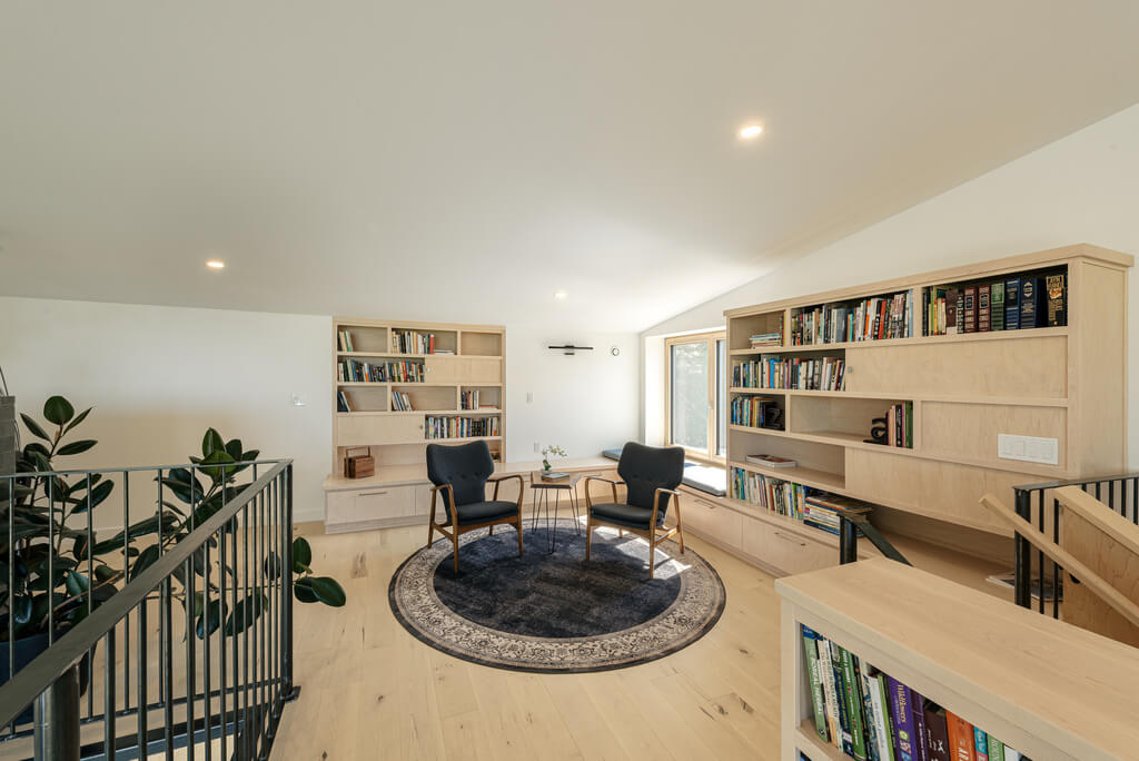 Two Rocks House Habit Studio room with furniture and a book shelf 
