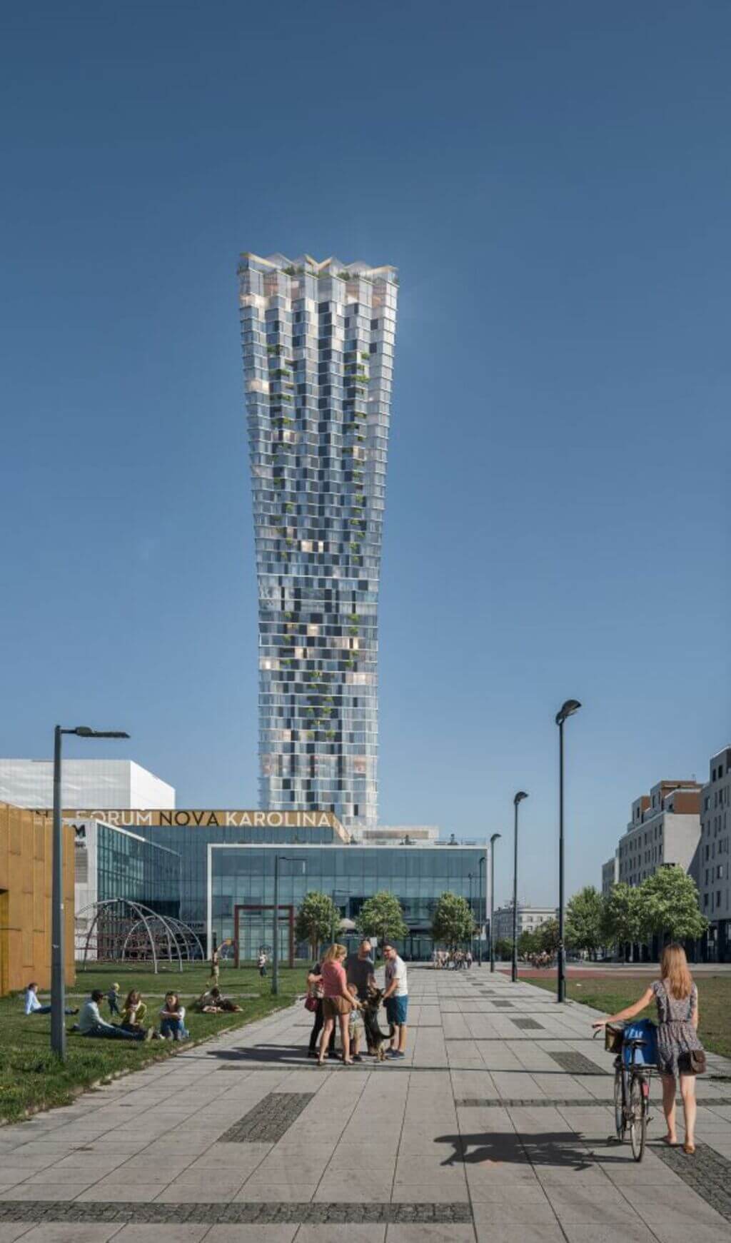 people riding bikes down a sidewalk next to Czech Republic's tallest skyscraper