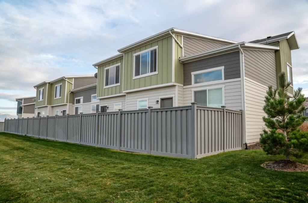 A row of houses with a fence