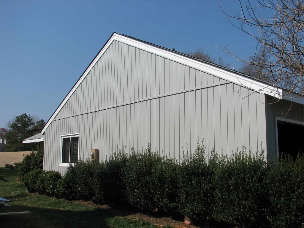 gray barn with a white roof