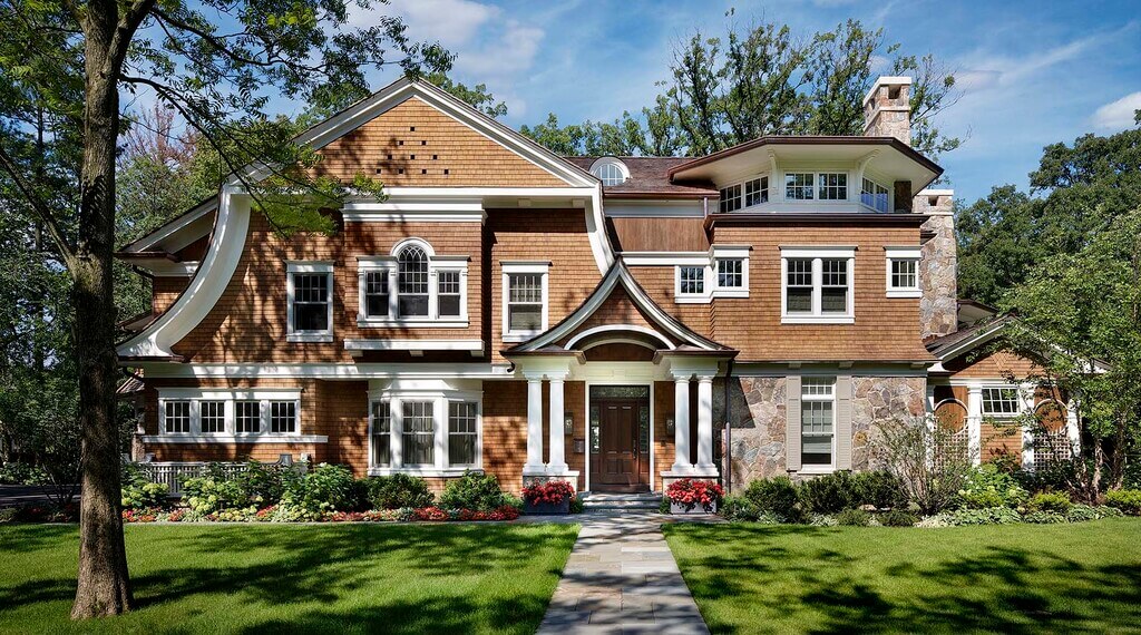 brown house with white trim and windows