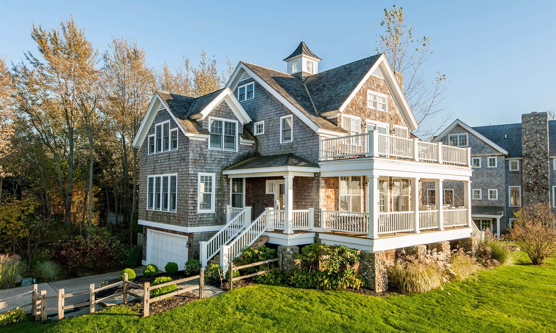 A large house with a steeple on the top of it
