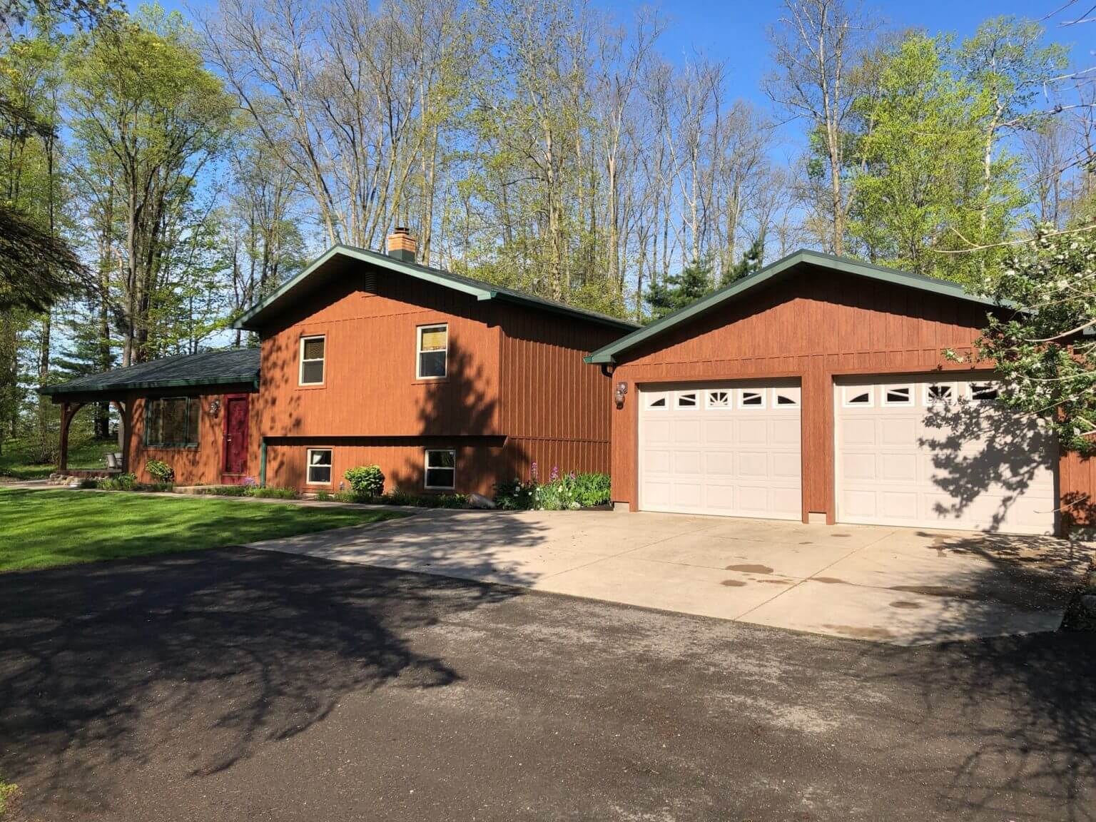 red color house with garage