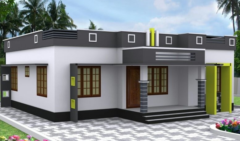 A small white and black house with green trim
