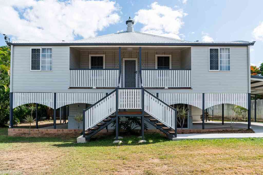 Queenslander homes with a porch and stairs 