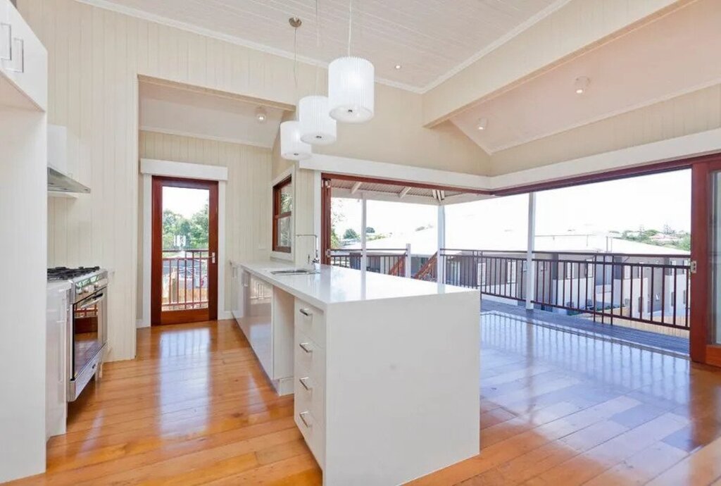 Queenslander homes large open kitchen with a white island
