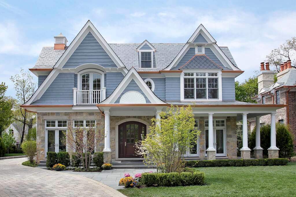 country house with light blue and white color exterior