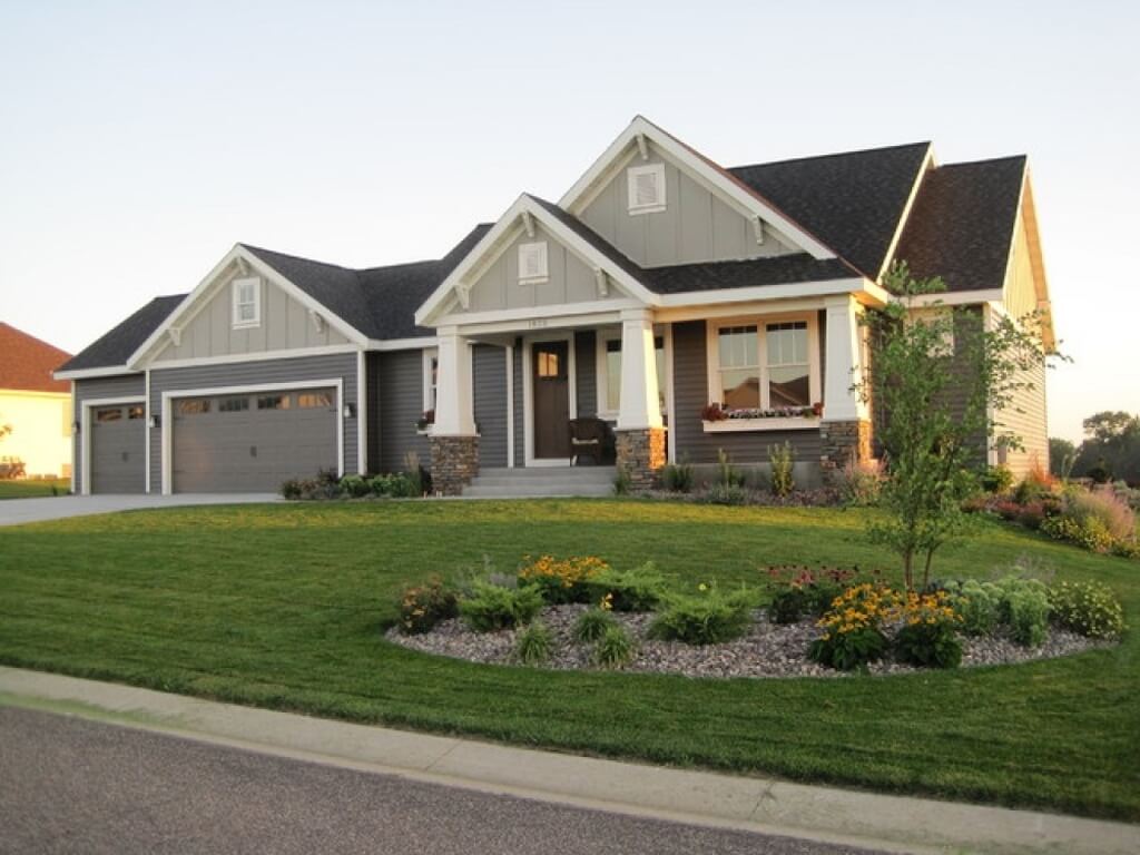 A house with a nice lawn in front of it
