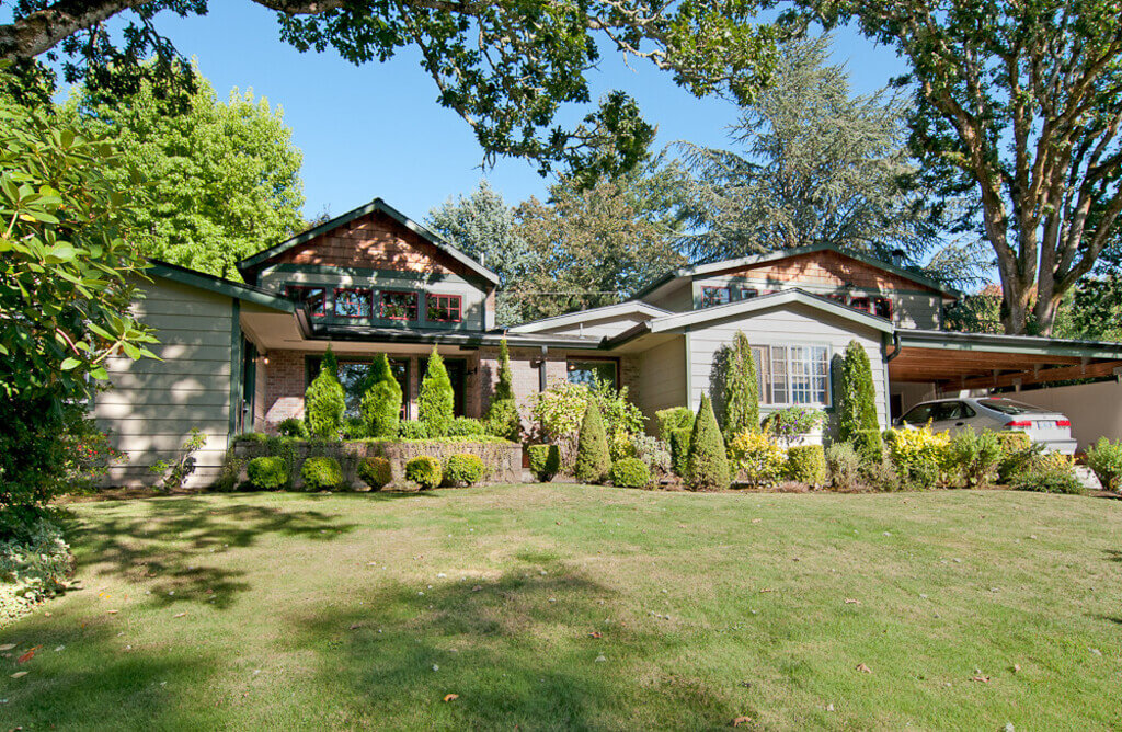 A house with a lot of trees in front of it
