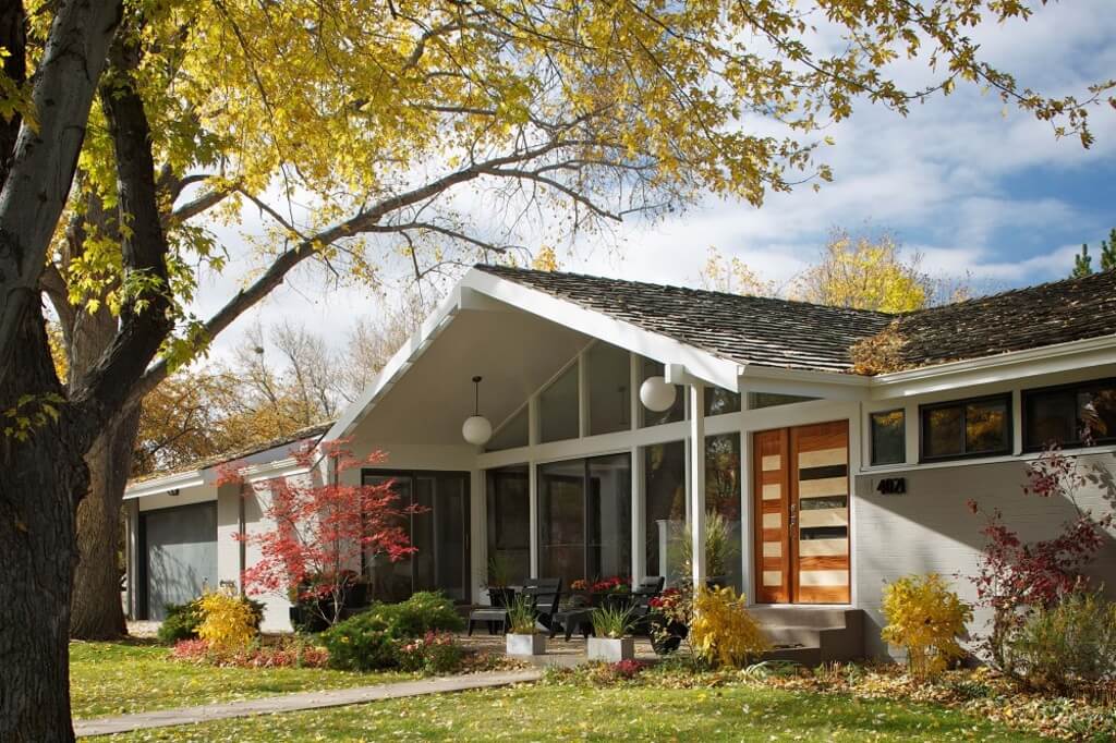 A house with a tree in front of it
