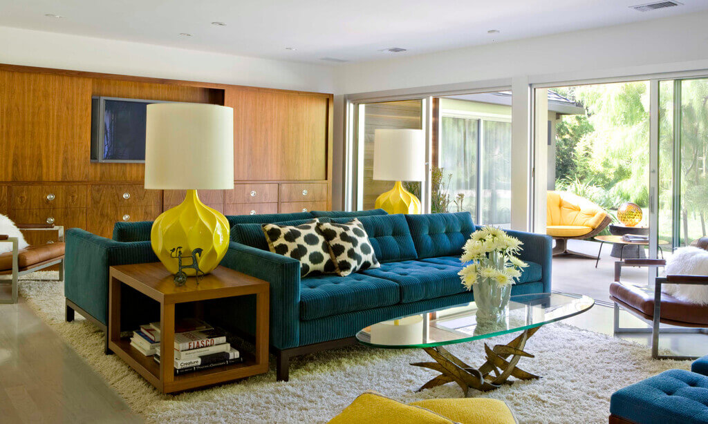 A living room filled with furniture and a large window
