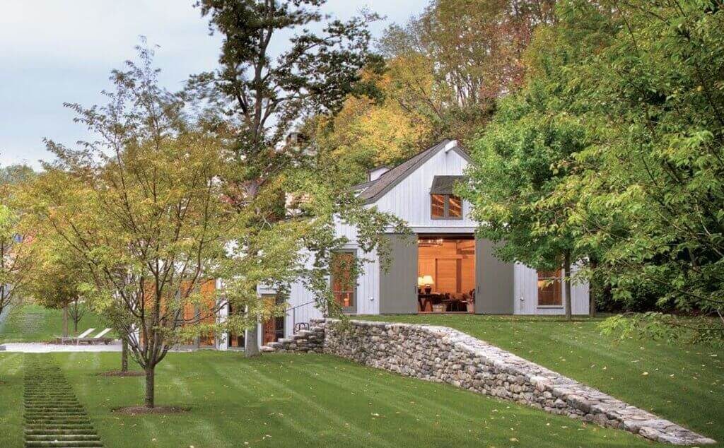 barn style house covered with trees