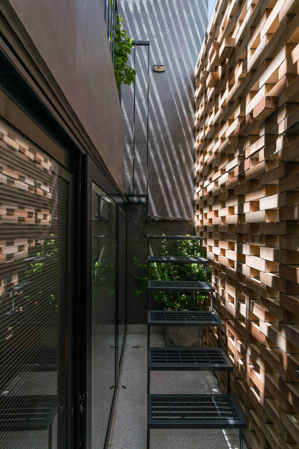 A staircase made out of wooden planks next to a building
