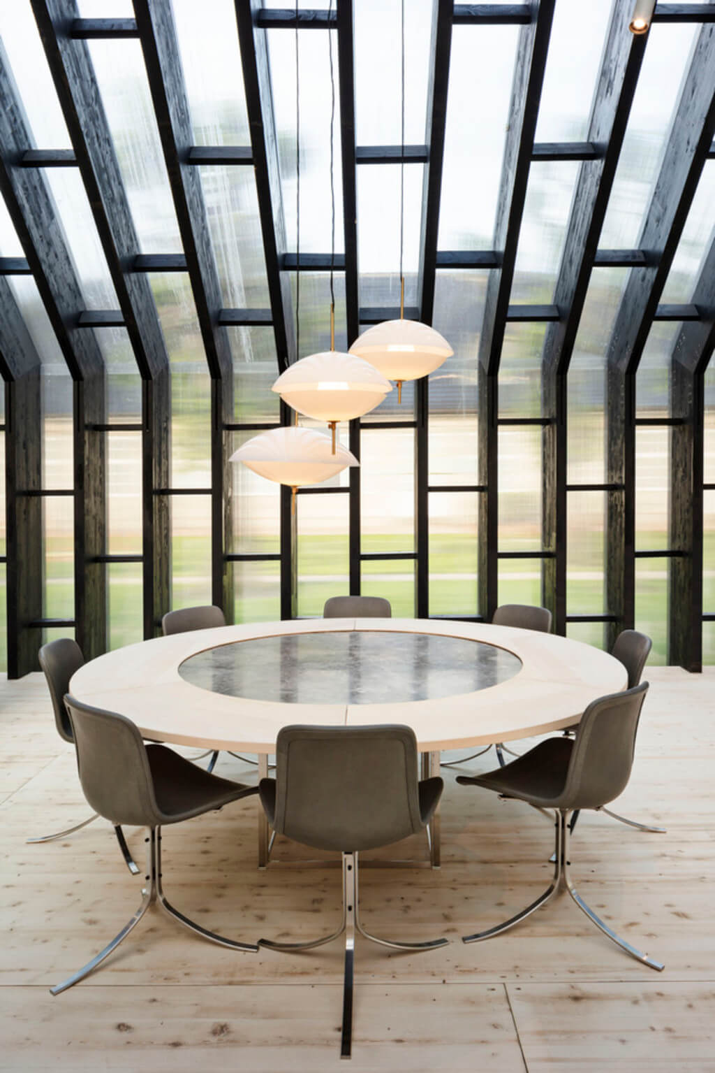 Fritz Hansen Pavilion dining room with a round table and chairs
