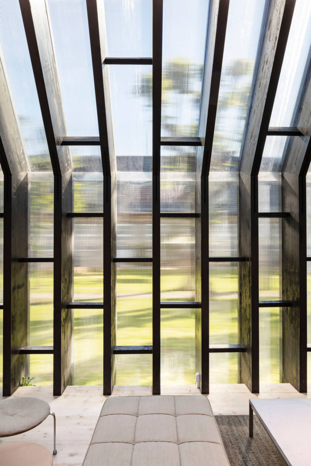 Fritz Hansen Pavilion room with a couch and large windows