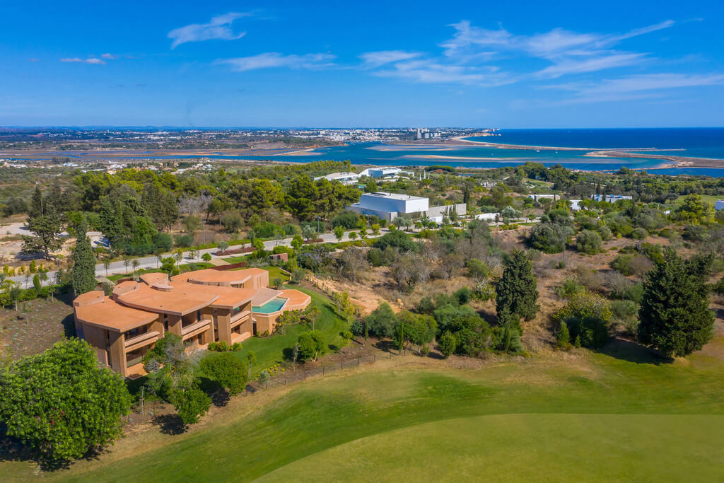 Red concrete resort villa aerial view