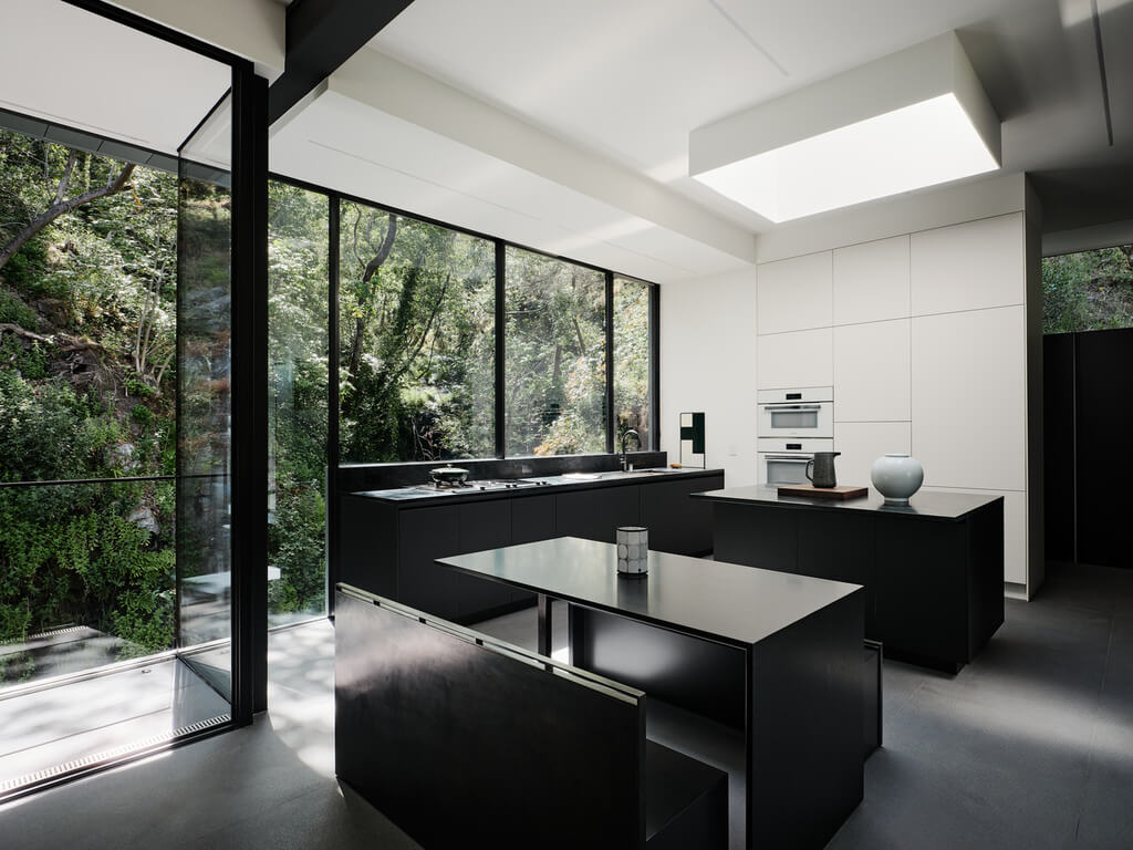 Suspension House kitchen with a large window and a sink