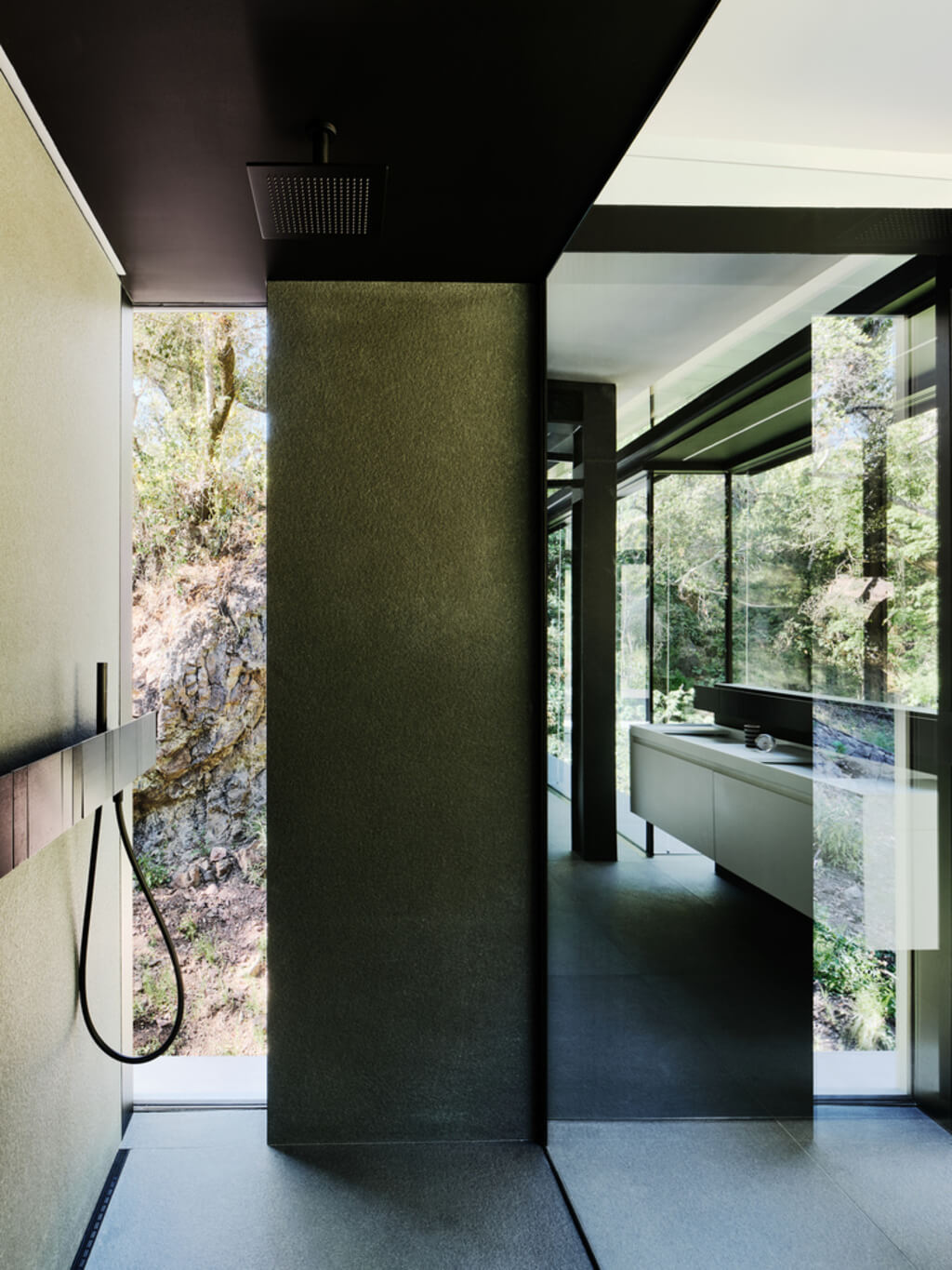 Suspension House bathroom with a black and white floor and walls
