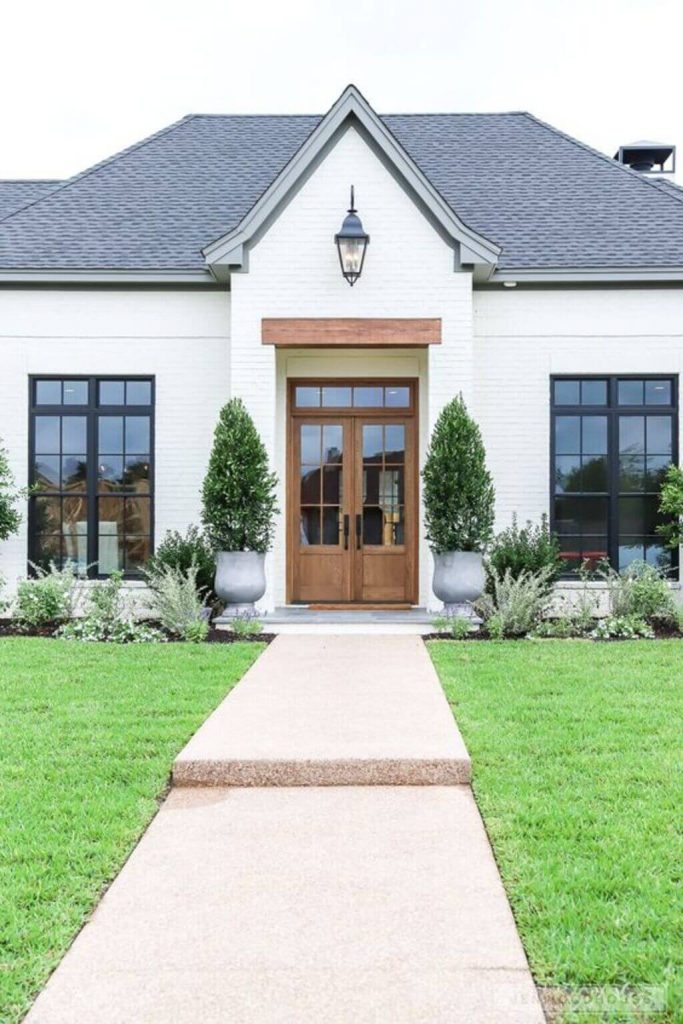 White Painted Brick House with Wooden Accents