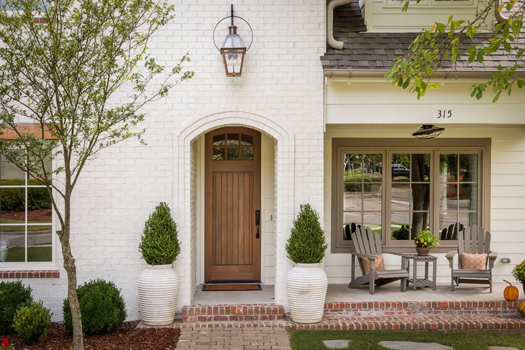Mediterranean-Themed White Painted Brick House