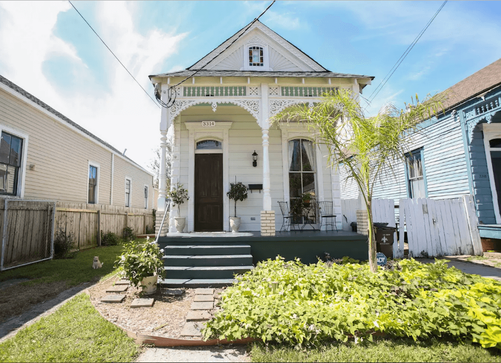 shotgun style houses with a porch and stairs 