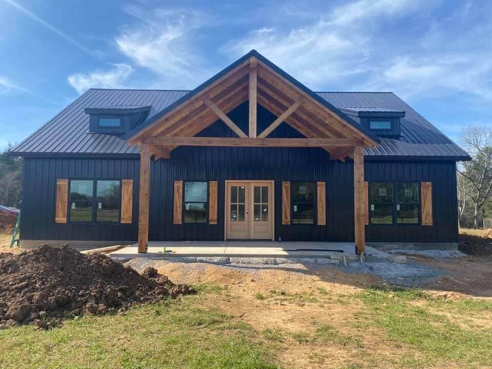 Black Barndominium with Wood Accents